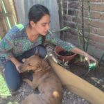 Paula and her dog gardening