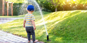 boy considering watering system